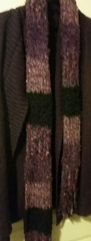 This a purple fuzzy vest with a beautiful scarf